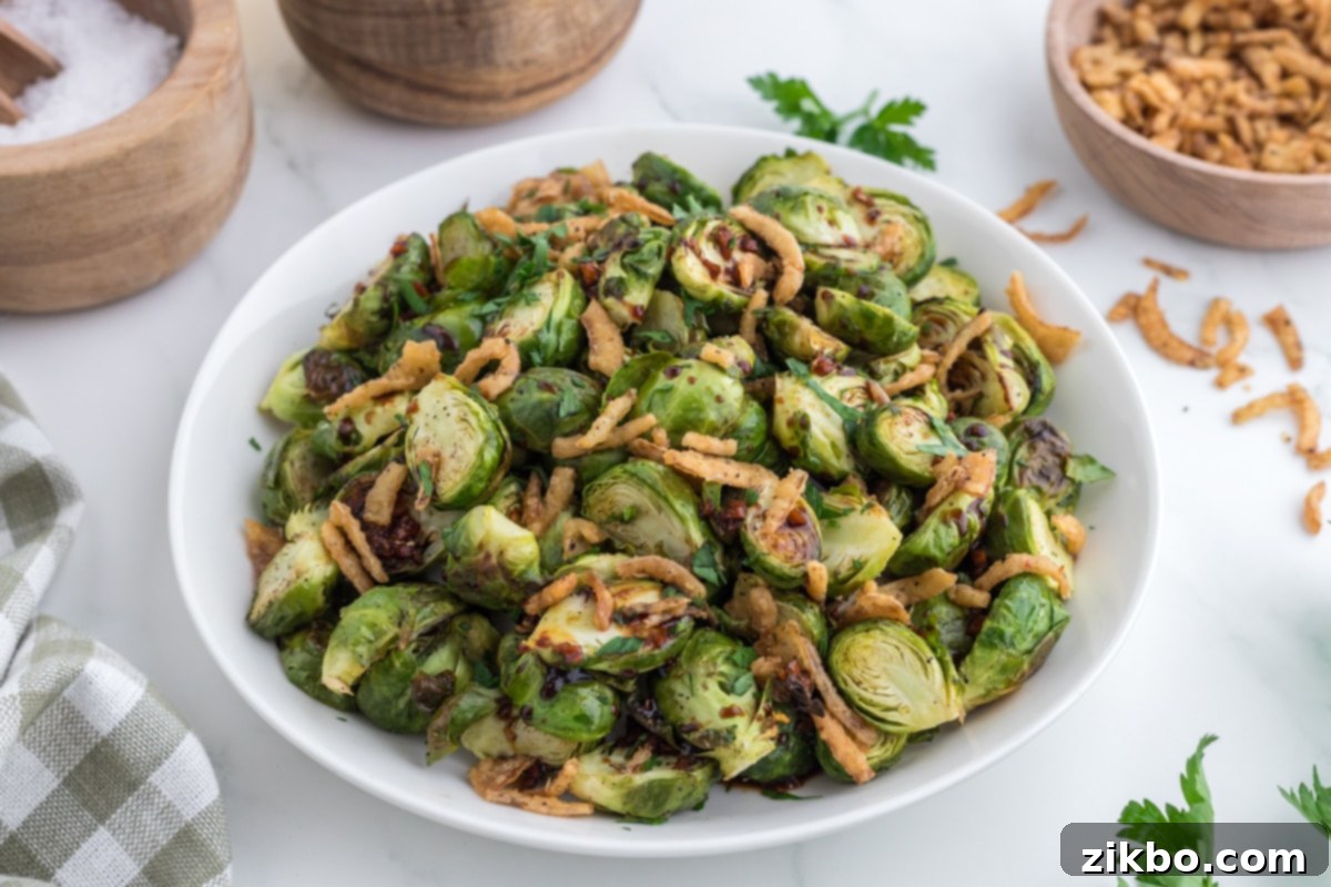 A large serving platter filled with roasted brussels sprouts.