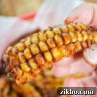 Air fryer corn ribs, a delectable vegan treat, beautifully cooked and sauced.