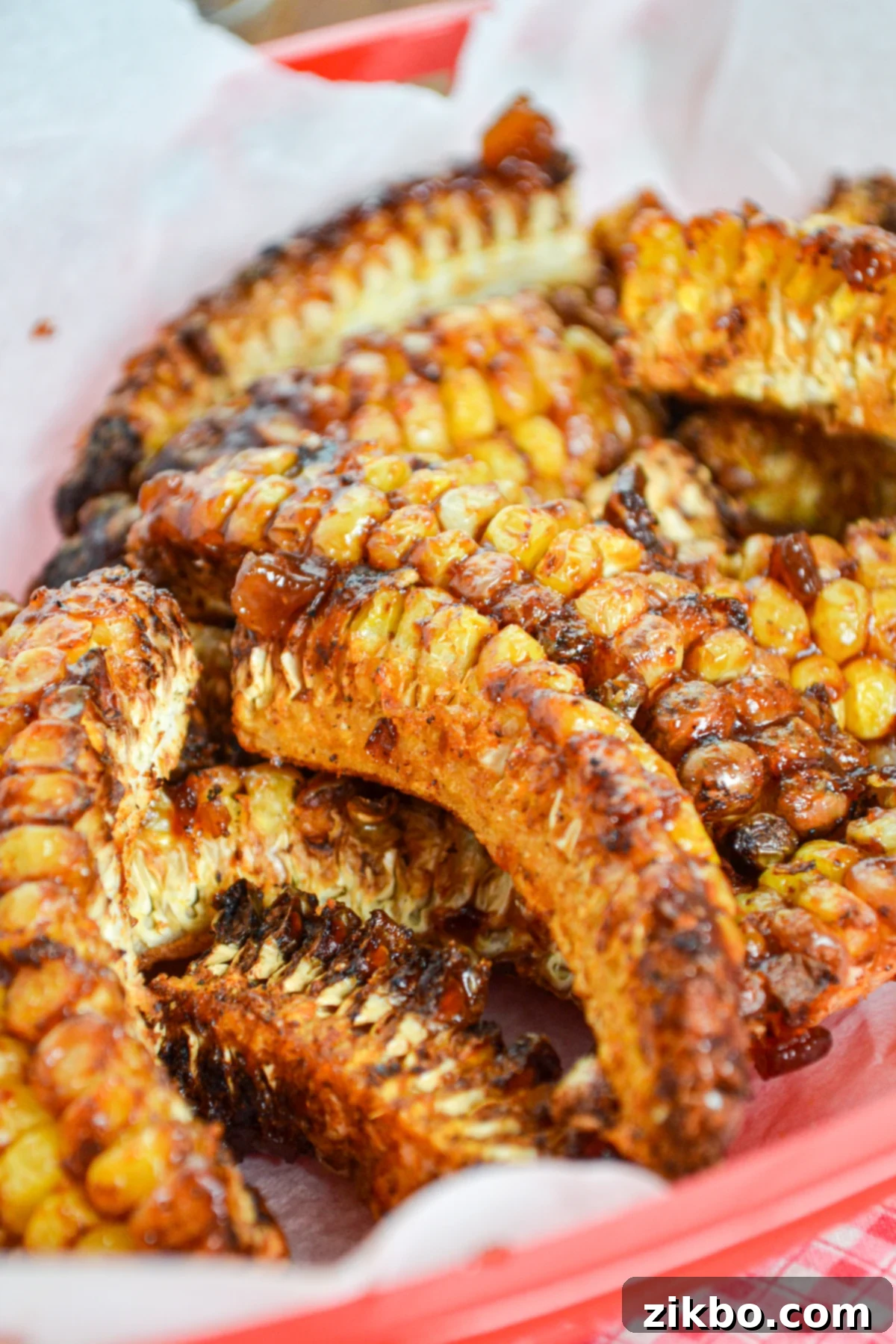 A basket of crispy, saucy corn ribs, made in the air fryer, clearly a crowd-pleaser.
