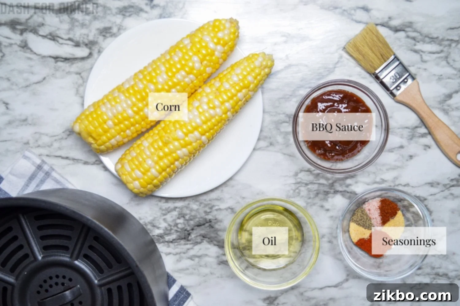 The essential ingredients laid out for making crispy and flavorful air fryer corn ribs.