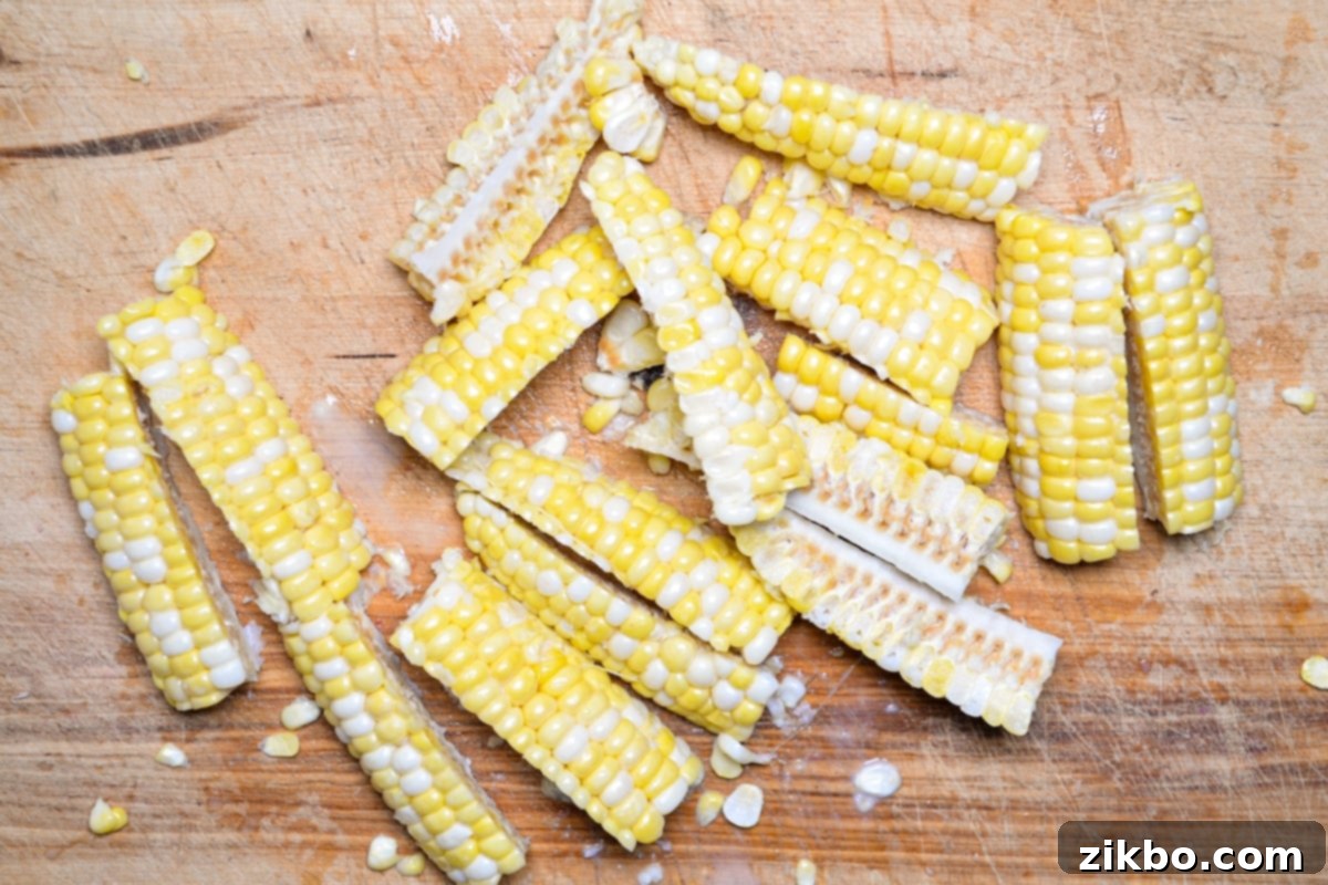 Precisely quartered corn cobs, perfectly prepared for making crispy air fryer corn ribs.