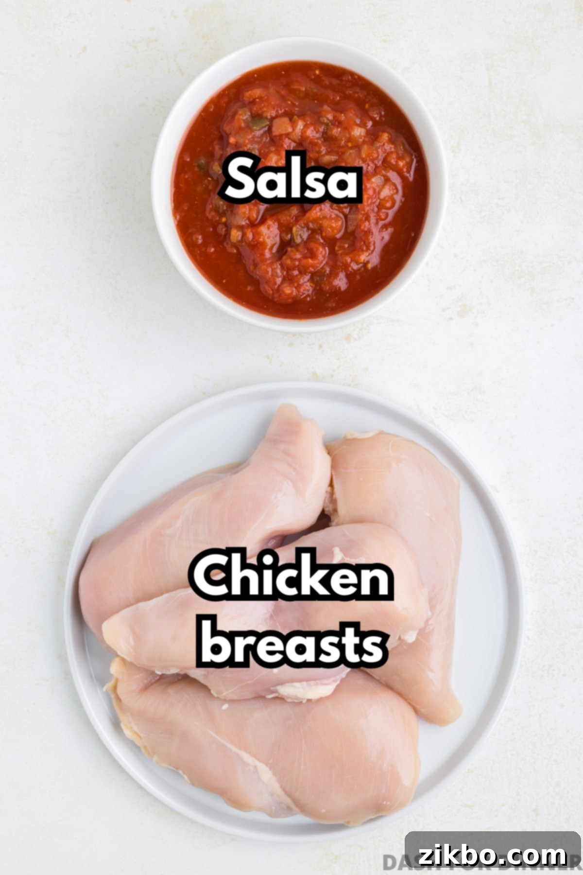 A plate of fresh boneless, skinless chicken breasts alongside a bowl of vibrant red salsa, ready for the slow cooker.