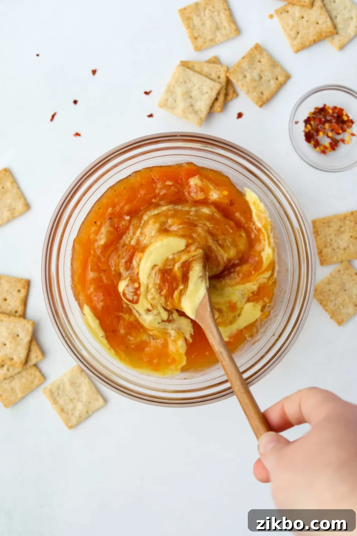 Spicy Southern Jezebel Dip 6 Step 3: Stirring all the Jezebel sauce ingredients together in the bowl until well combined