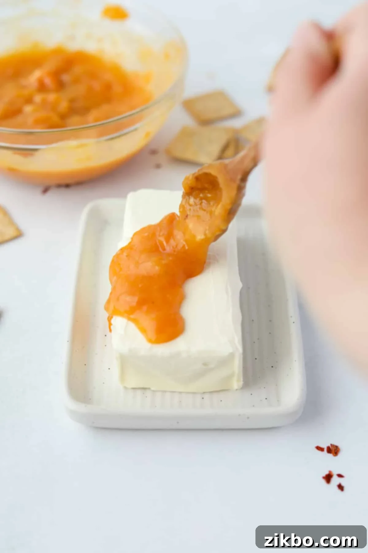Spicy Southern Jezebel Dip 8 Step 5: Softened block of cream cheese placed on a white serving plate