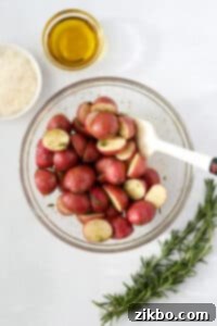 Baby potatoes that have been tossed in seasoned oil.