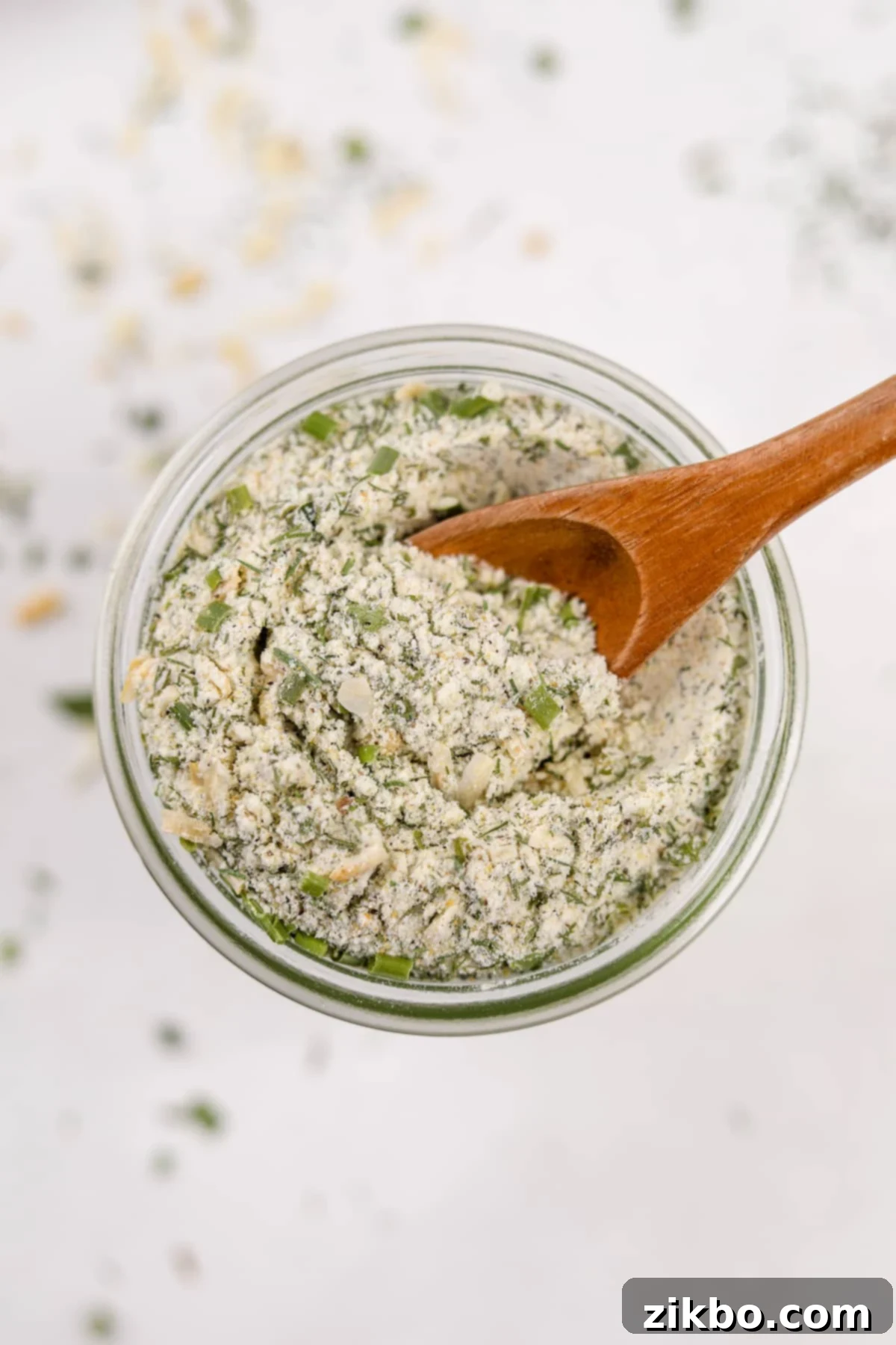 A small jar filled with homemade ranch seasoning, ready to be stored or used.