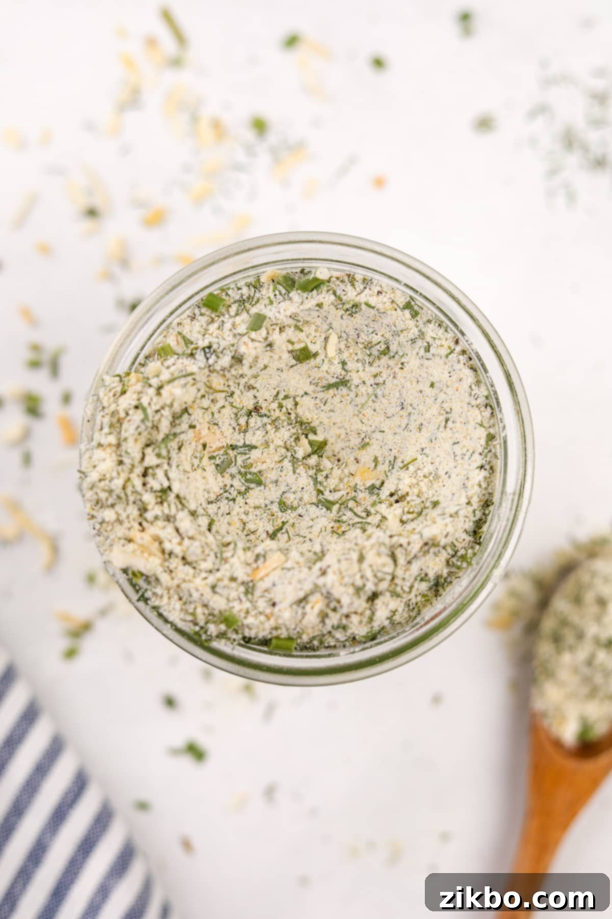 An overhead photo of a jar of homemade ranch seasoning, showcasing its rustic charm and readiness.