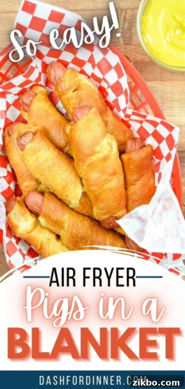Crispy Air Fryer Pigs in a Blanket 11 A top-down view of air fryer pigs in a blanket arranged on a wooden board, with various dipping sauces in small bowls.