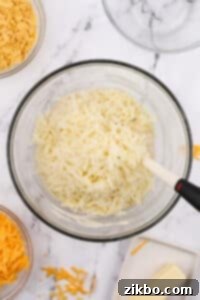 A large bowl with shredded hash browns inside.