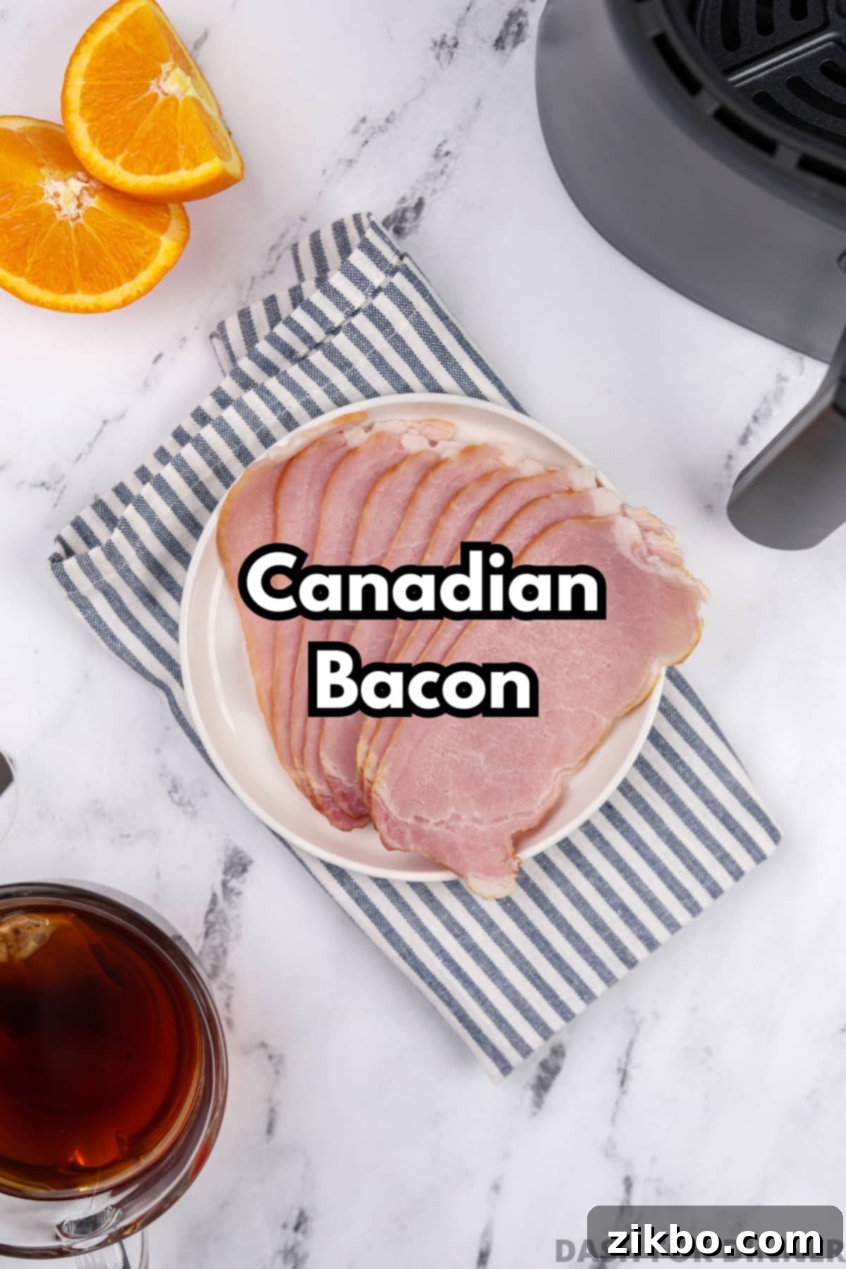 A plate with several slices of uncooked Canadian back bacon.