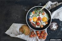 Fried Eggs with Burst Cherry Tomatoes and Basil